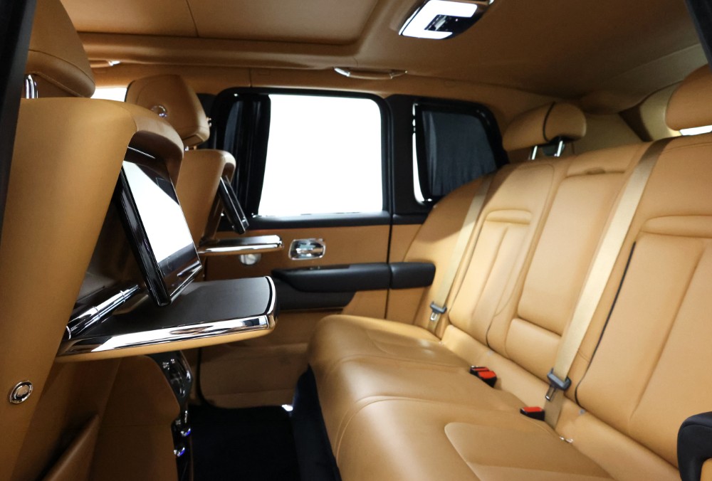 Rear seats of white Rolls-Royce Cullinan Black Badge