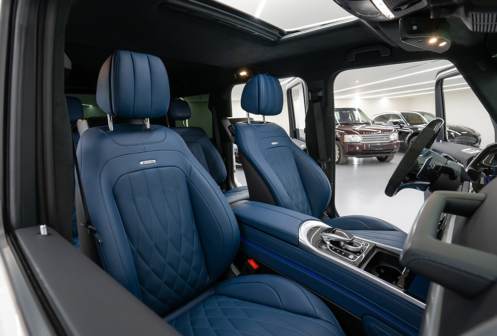 Rent White Mercedes Benz G Class G 63 AMG front seat view