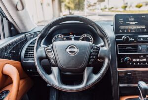 Steering view of white Nissan Patrol LE Platinum