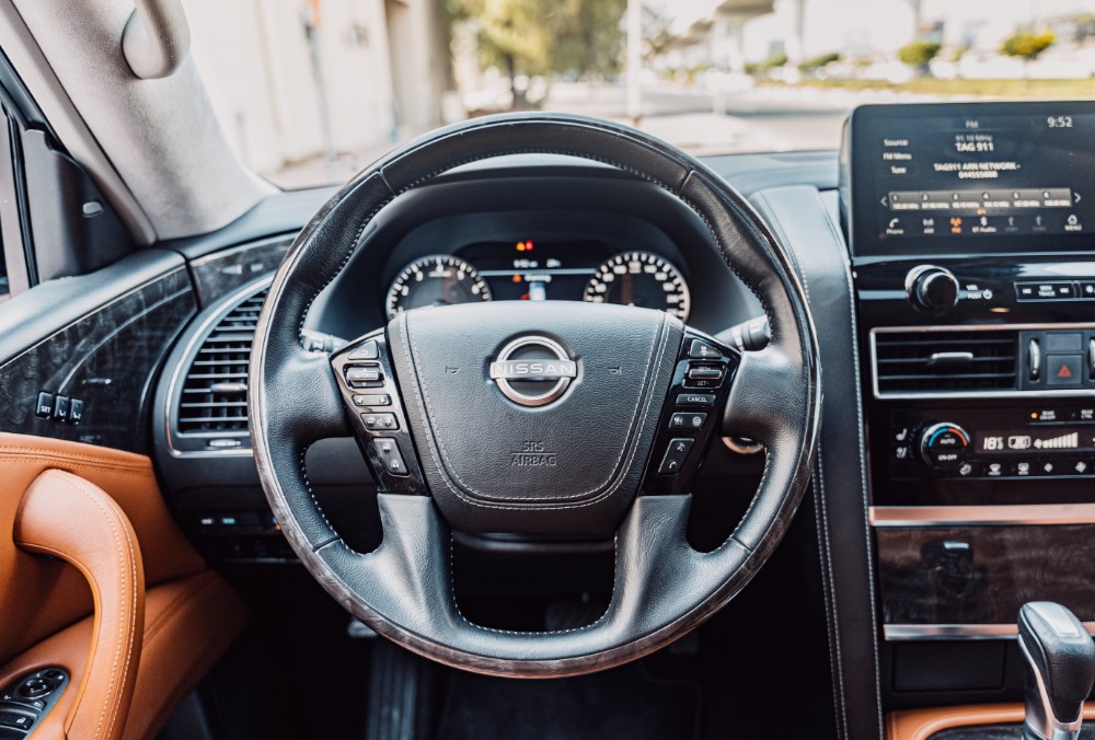 Steering view of white Nissan Patrol LE Platinum