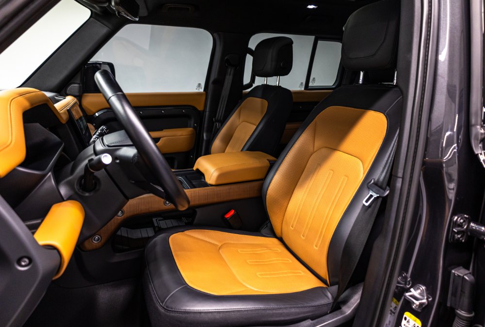 Land Rover Defender 110 front seats side view