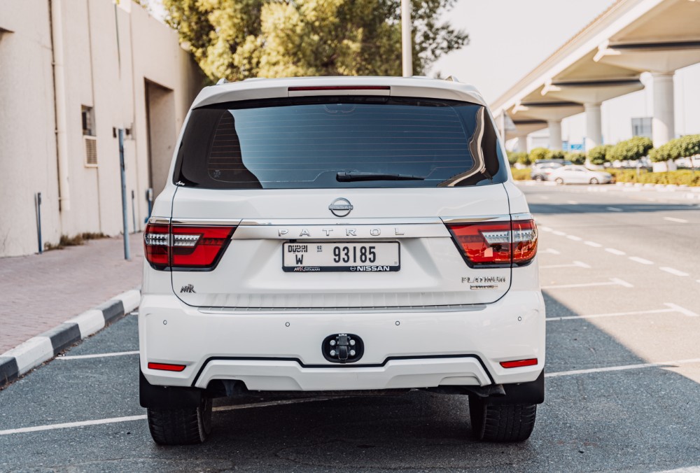 Dynamic view of white Nissan Patrol LE Platinum