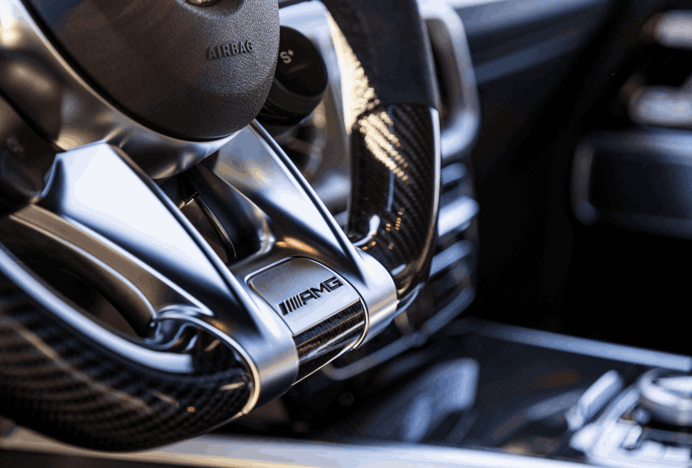Mercedes G63 steering wheel badge closeup