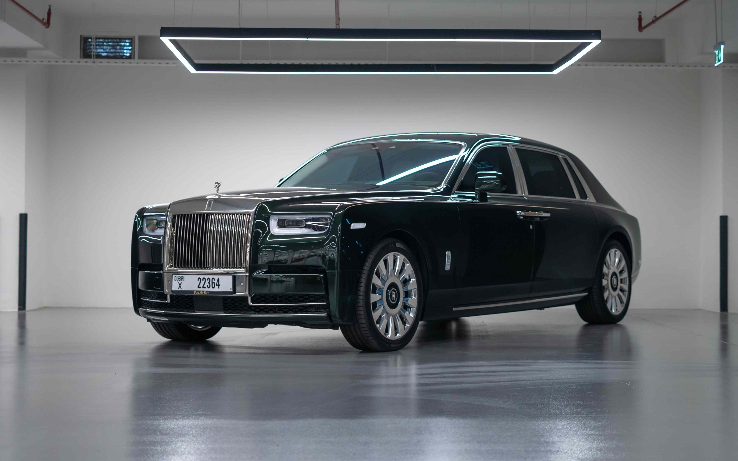 Side view of a Rolls-Royce Phantom, luxury sedan with iconic design features.