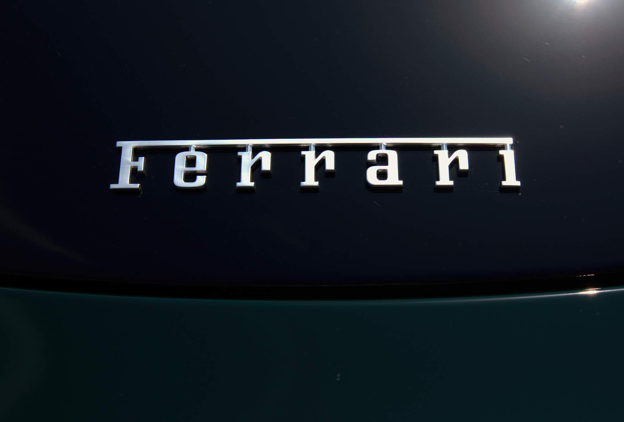 Green Ferrari Roma Spider back logo
