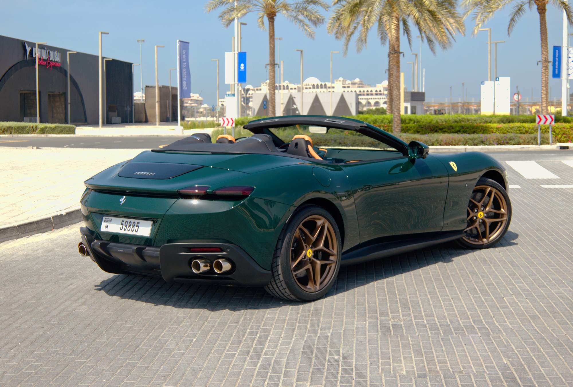 Green Ferrari Roma Spider rear angle view