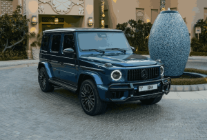 Blue Mercedes G63 AMG front angle view