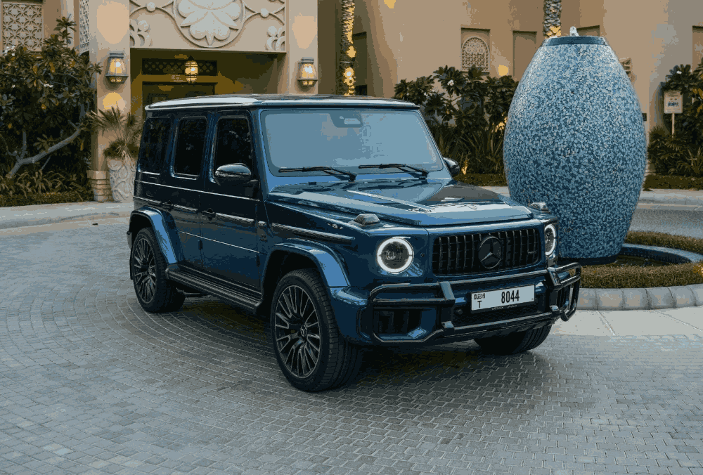 Blue Mercedes G63 AMG front angle view