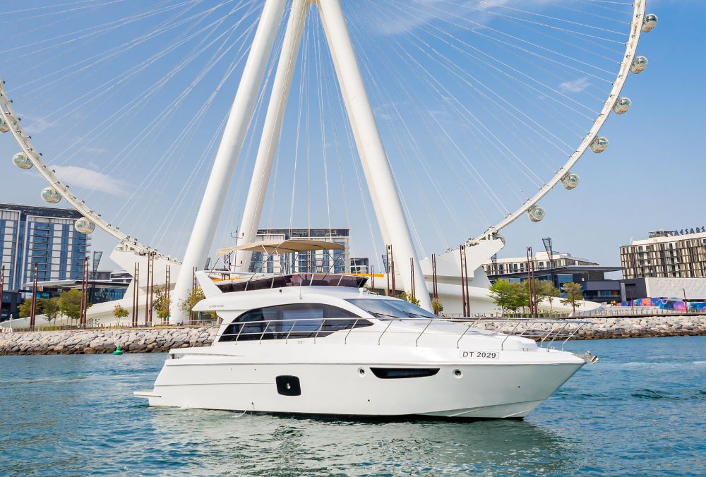 KIO C-52 luxury yacht rental in Dubai with two private cabins, spacious sun deck, and capacity for 17 guests ideal for private charters and events
